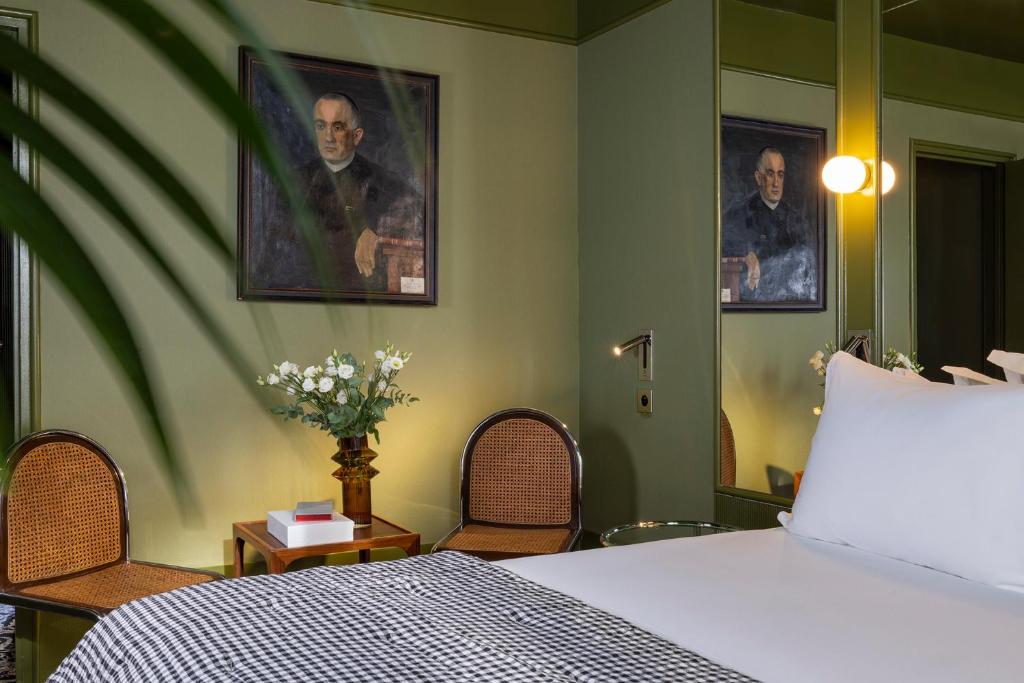 Postel nebo postele na pokoji v ubytování Hôtel La Conversation