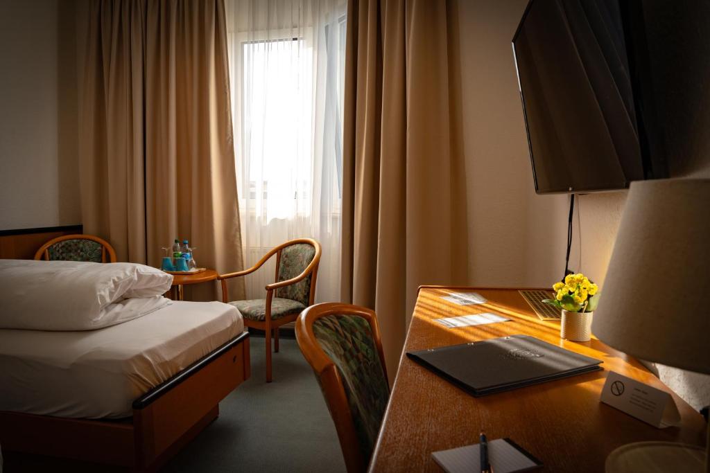 Postel nebo postele na pokoji v ubytování E&D Hotel Rodgau