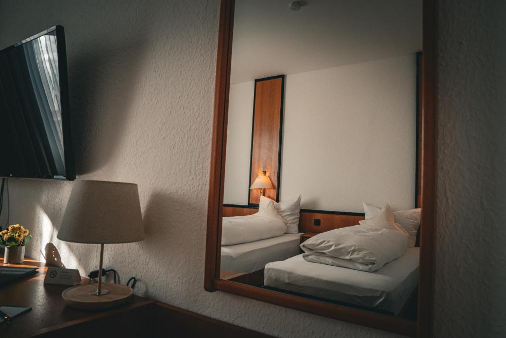 Postel nebo postele na pokoji v ubytování E&D Hotel Rodgau