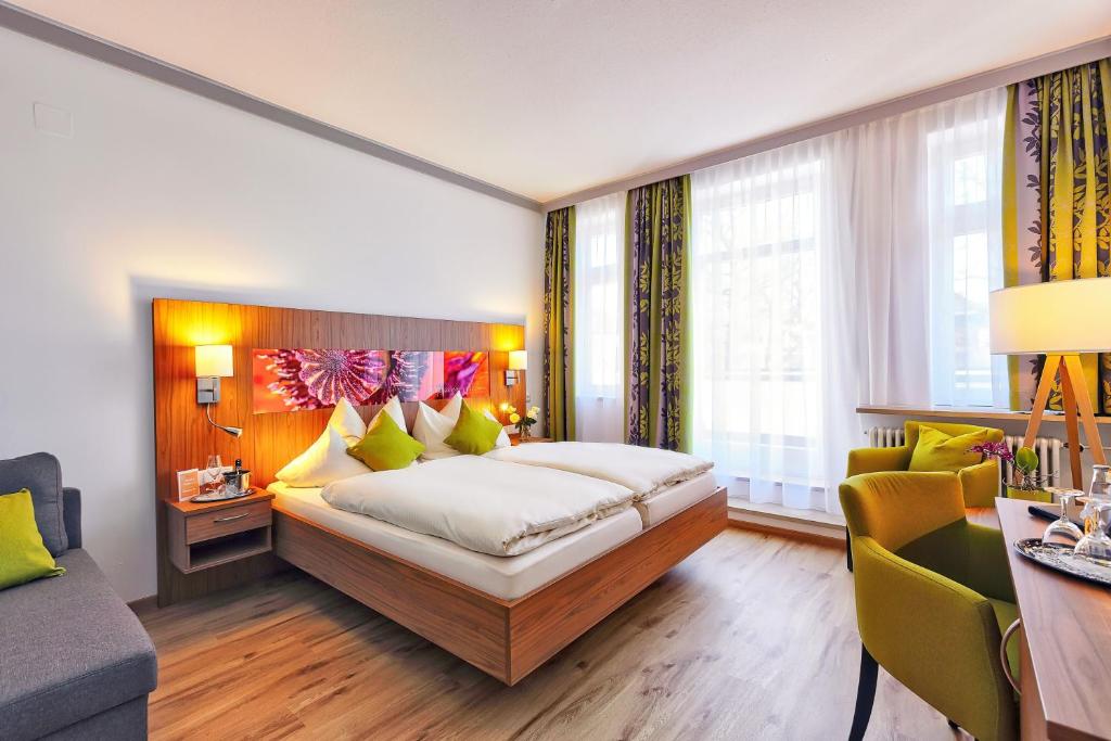Postel nebo postele na pokoji v ubytování Hotel Sonnengarten