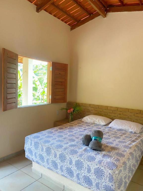 Un pat sau paturi într-o cameră la Chalé Sol