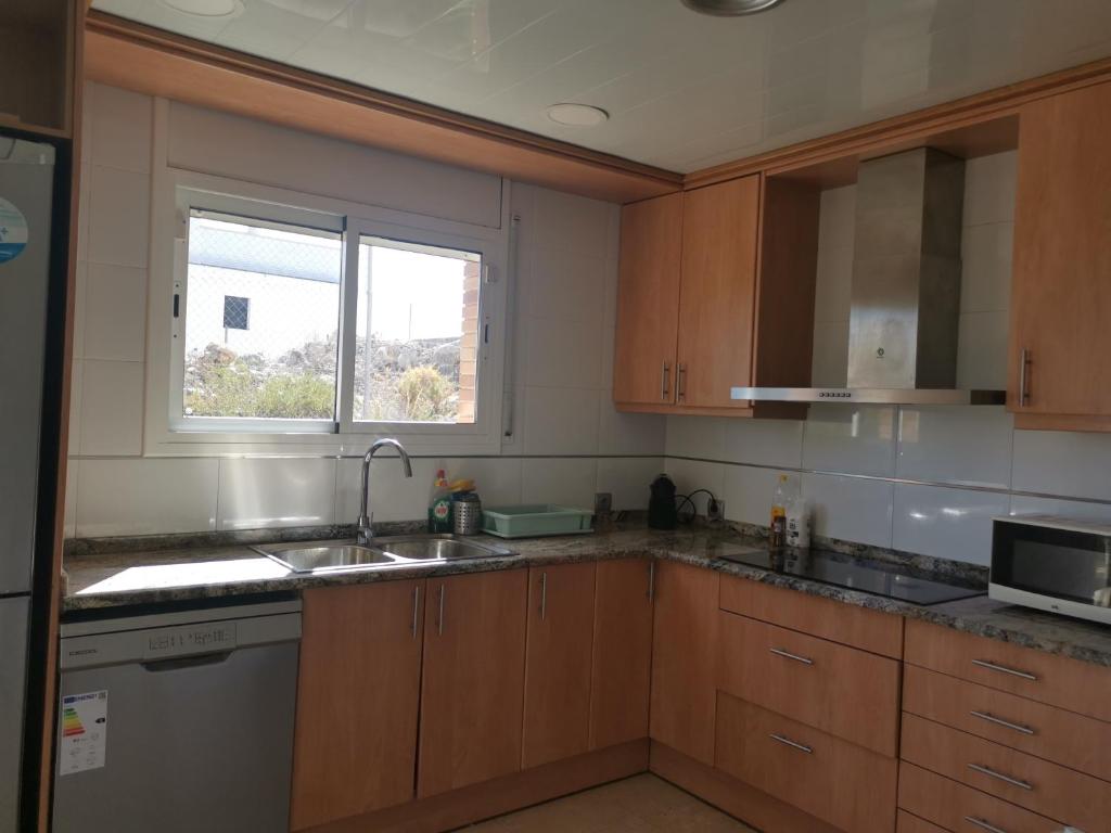 Kuchyň nebo kuchyňský kout v ubytování CAN TRULLEN CHALET CALAFELL