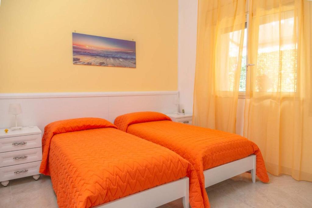 A bed or beds in a room at Villa Milla