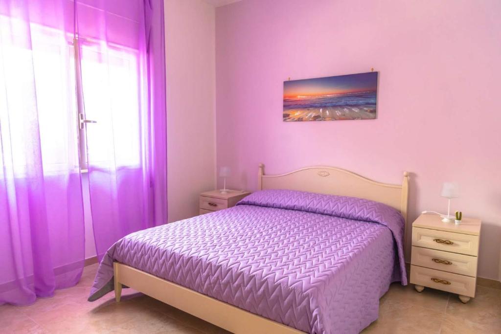 A bed or beds in a room at Villa Milla