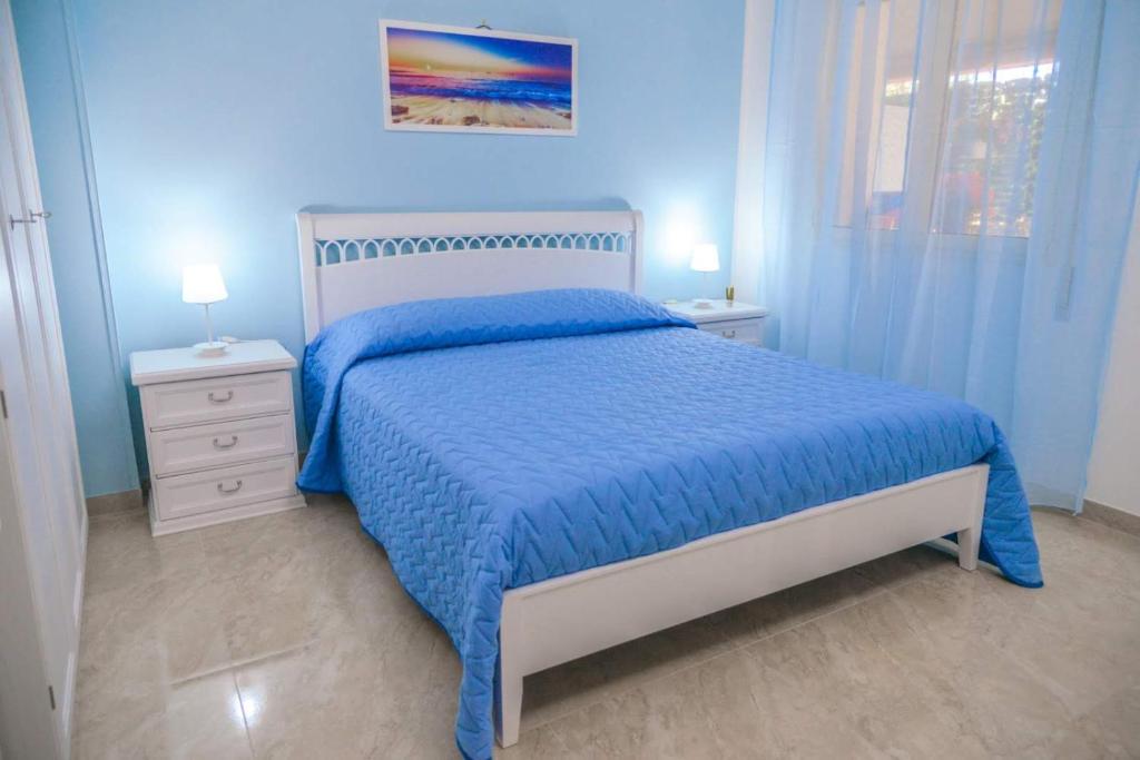A bed or beds in a room at Villa Milla