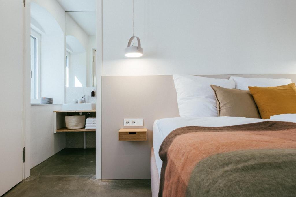 Postel nebo postele na pokoji v ubytování STADTQUARTIER Windischeschenbach