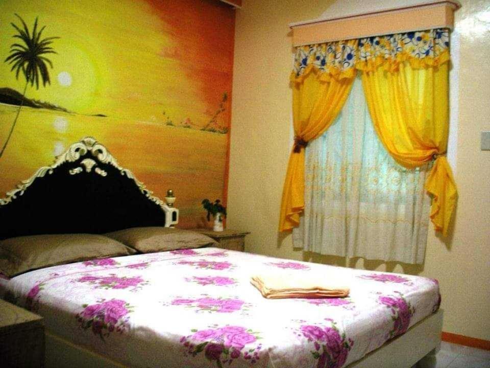 a bedroom with a large bed and a window at Nasan View Resort 