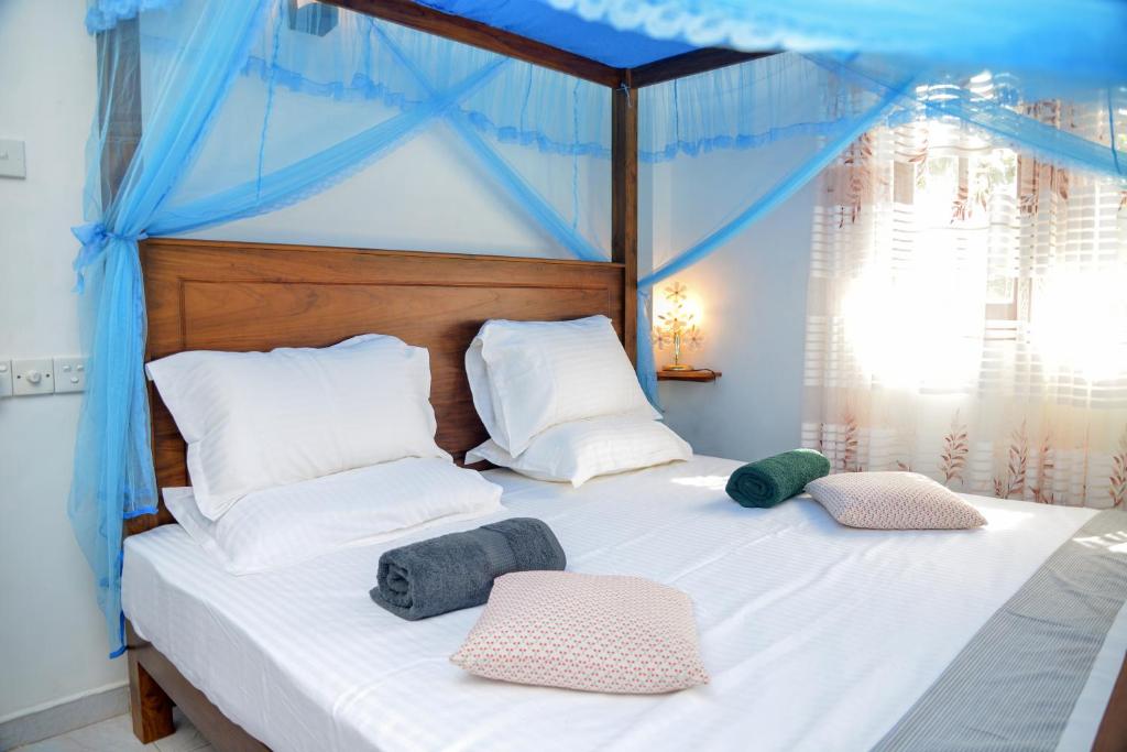 Postel nebo postele na pokoji v ubytování Villa Methsandi
