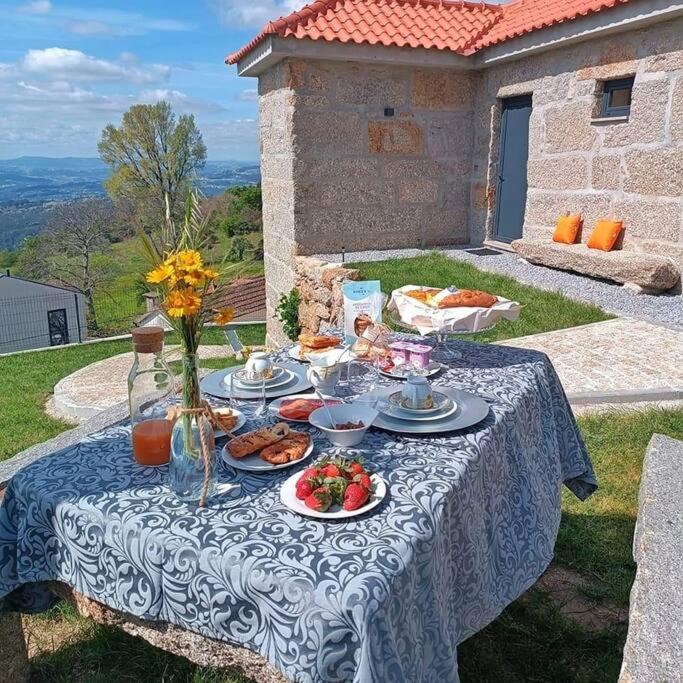 a blue and white table with food on it at Casa Nova de Senradelas in Marco de Canaveses