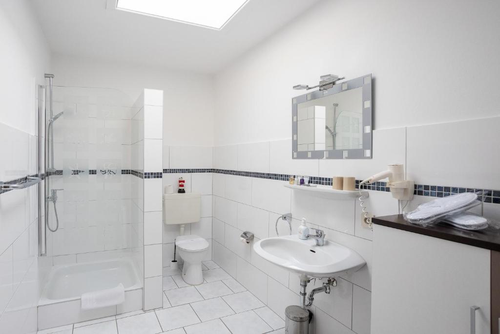 Ein Badezimmer in der Unterkunft Familien- und Aparthotel Strandhof