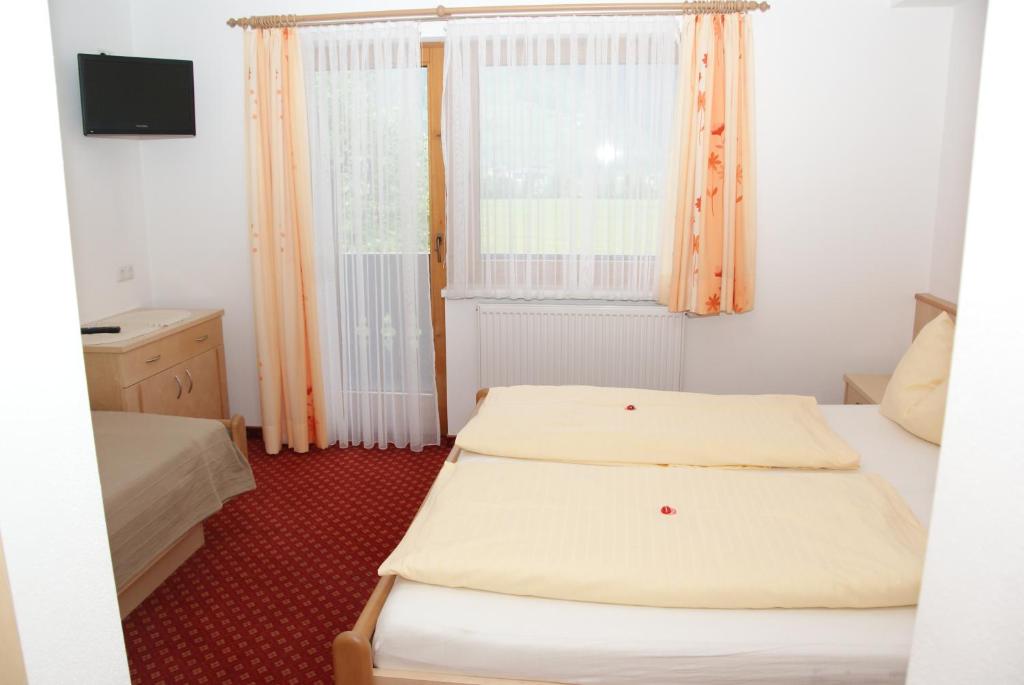 Postel nebo postele na pokoji v ubytování Landhaus Rauch