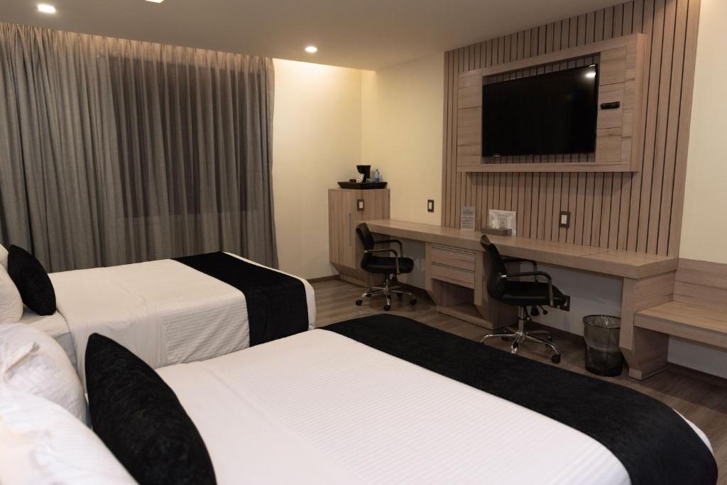 Postel nebo postele na pokoji v ubytování Domun Hotel