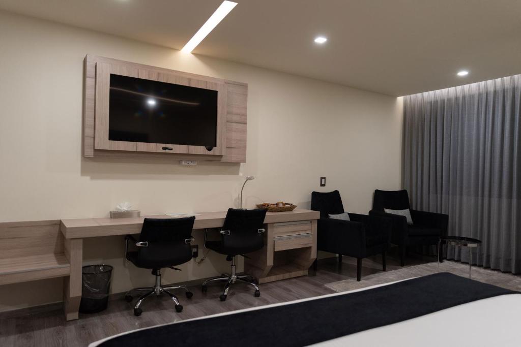 TV a/nebo společenská místnost v ubytování Domun Hotel