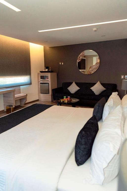 Postel nebo postele na pokoji v ubytování Domun Hotel