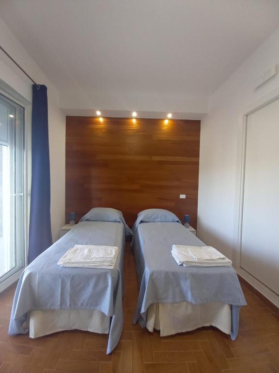 Postel nebo postele na pokoji v ubytování L'Attico di Matilde