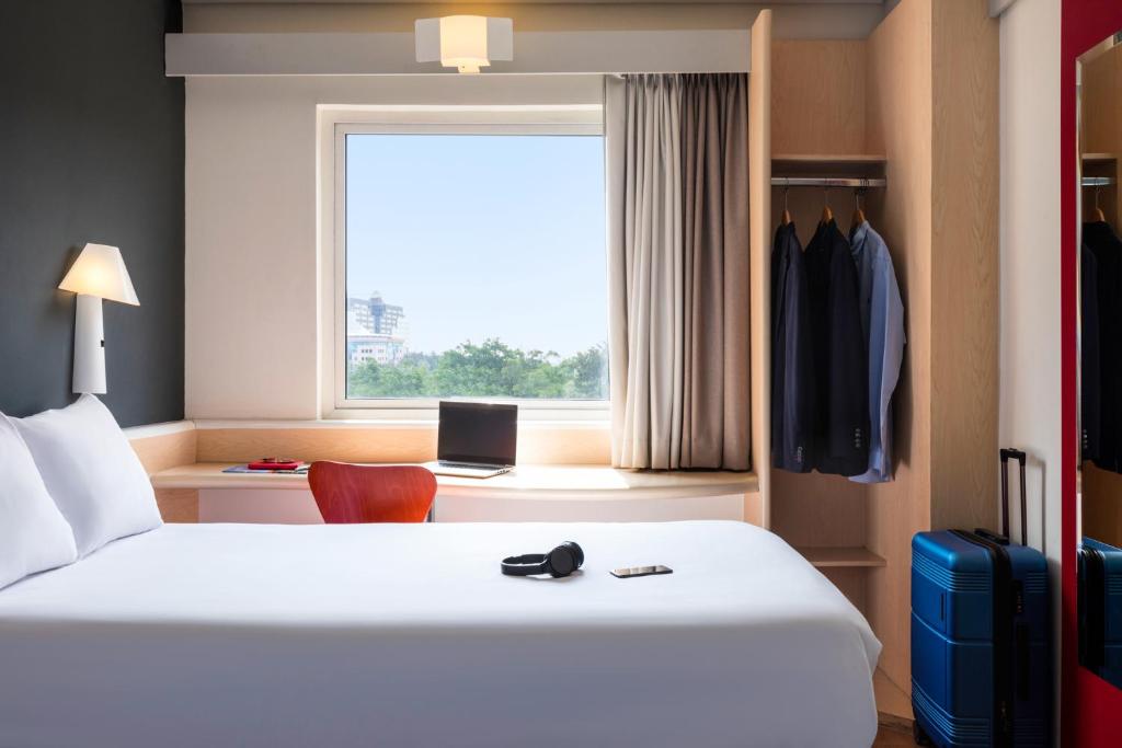 Postel nebo postele na pokoji v ubytování Ibis Guadalajara Expo
