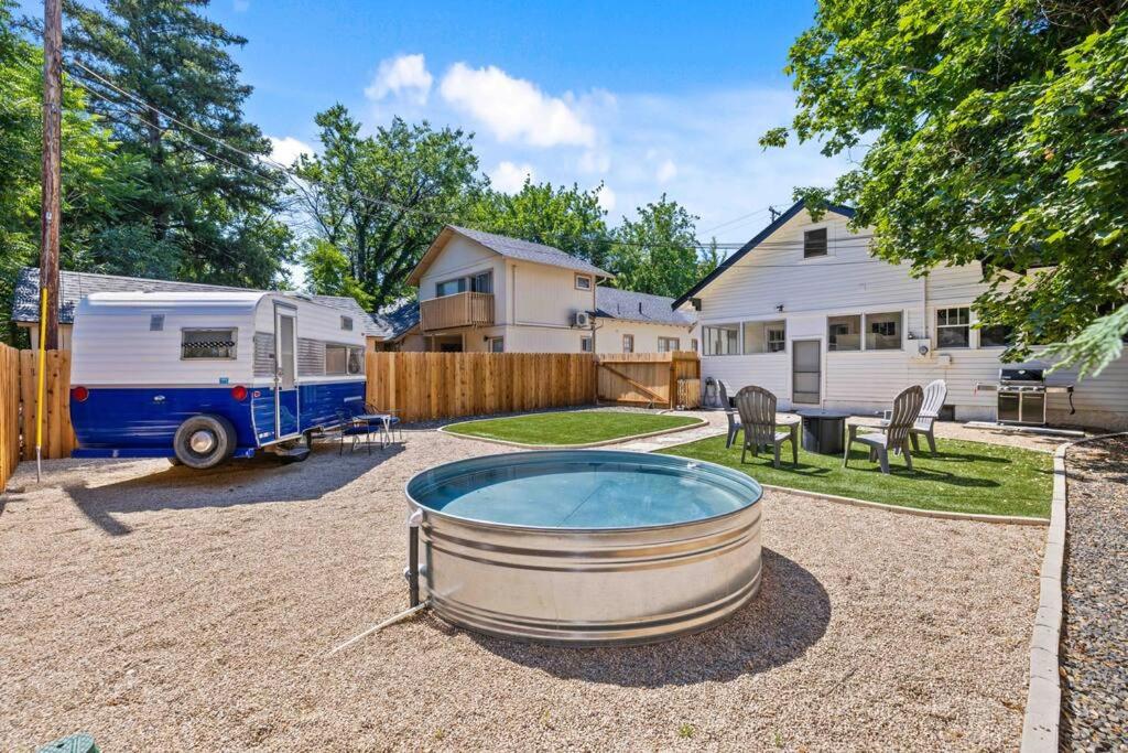 a backyard with a hot tub and a trailer at Downtown Bungalow with Geothermal Hot Spring in Boise