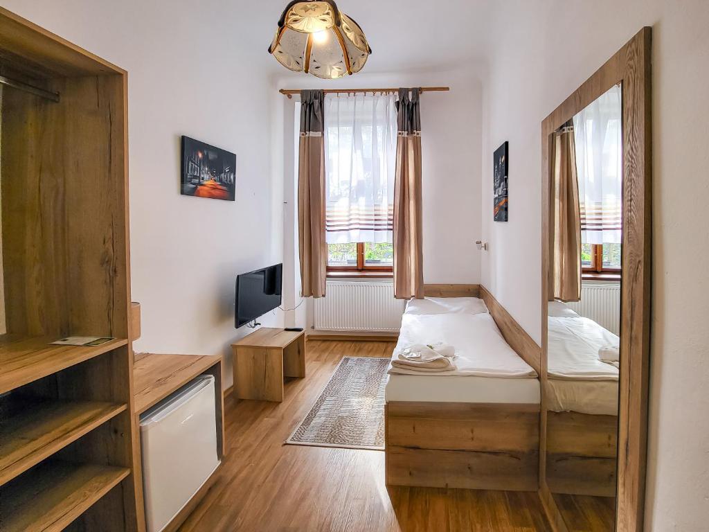 Postel nebo postele na pokoji v ubytování Pension City