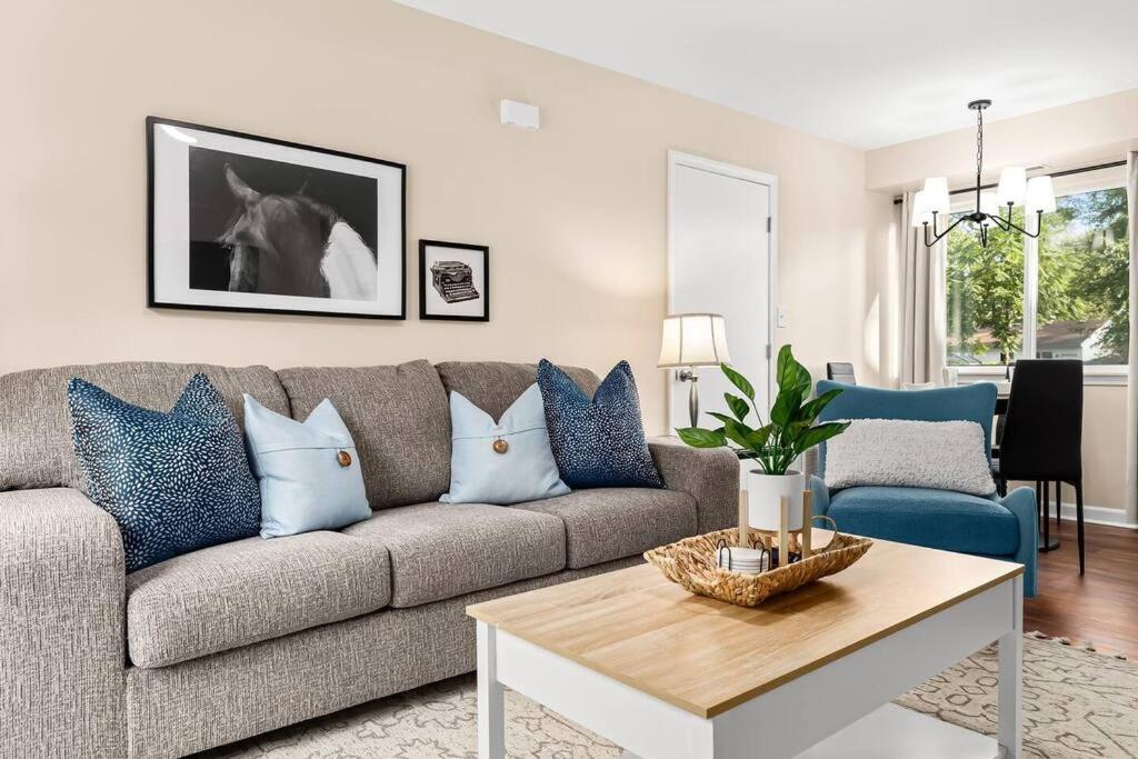 a living room with a couch and a table at New! Comfy Flat near Downtown Roseville in Roseville