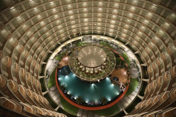 an overhead view of a spiral building with a pool at Rajhans Belliza , Hotel apartment units in Surat