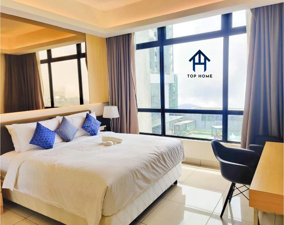 a bedroom with a large bed and a large window at Grand Ion Delemen Premium Suites & Room by TOP HOME in Genting Highlands