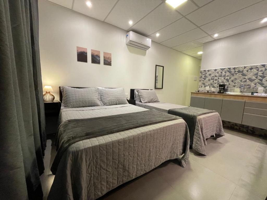 En eller flere senge i et værelse på VILLA BILAC 09 - Studio Urbano próximo à Villa Germânica Bairro da Velha