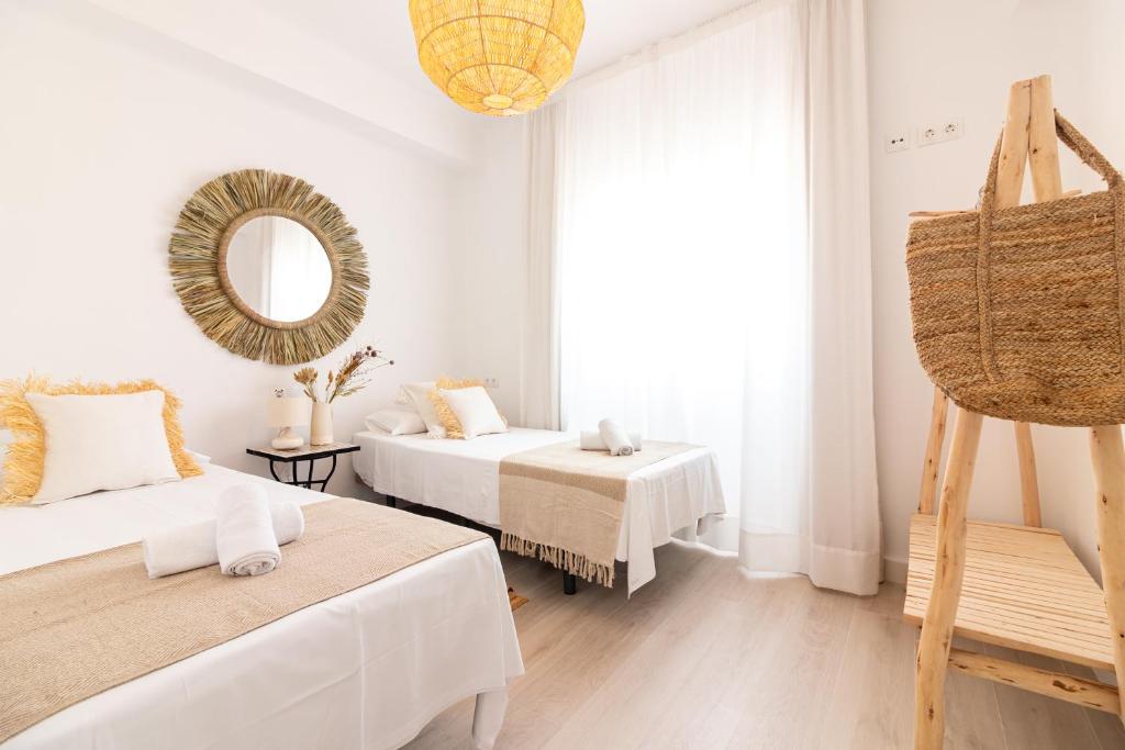Posteľ alebo postele v izbe v ubytovaní Malaga Center Flat Holidays City Center