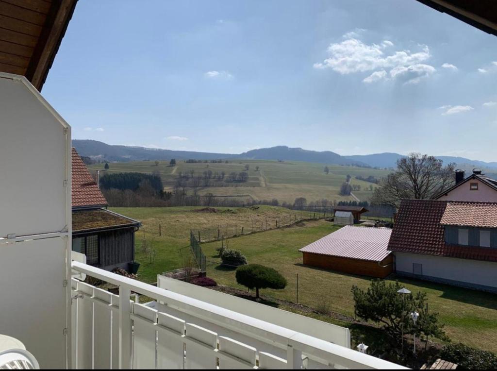 a view of a field from a balcony of a house at Landhaus Schneeberg in Mosbach