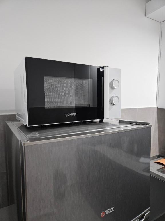 Kuchyň nebo kuchyňský kout v ubytování Apartman N&N