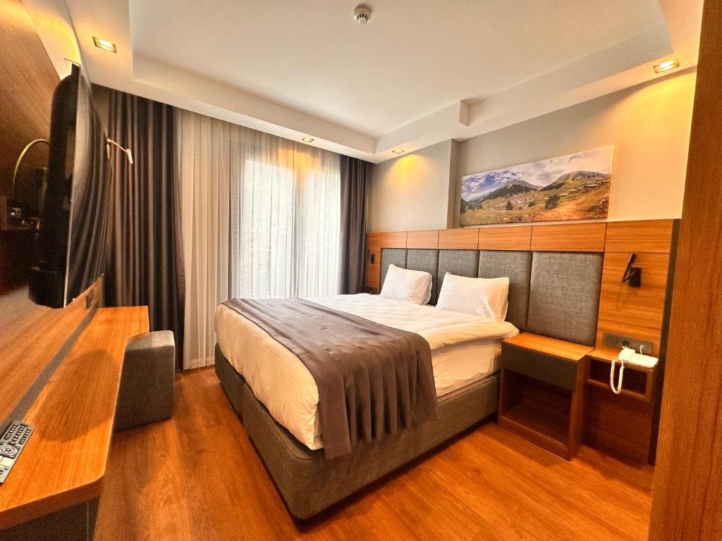 Postel nebo postele na pokoji v ubytování Golden Inn Airport - TRABZON