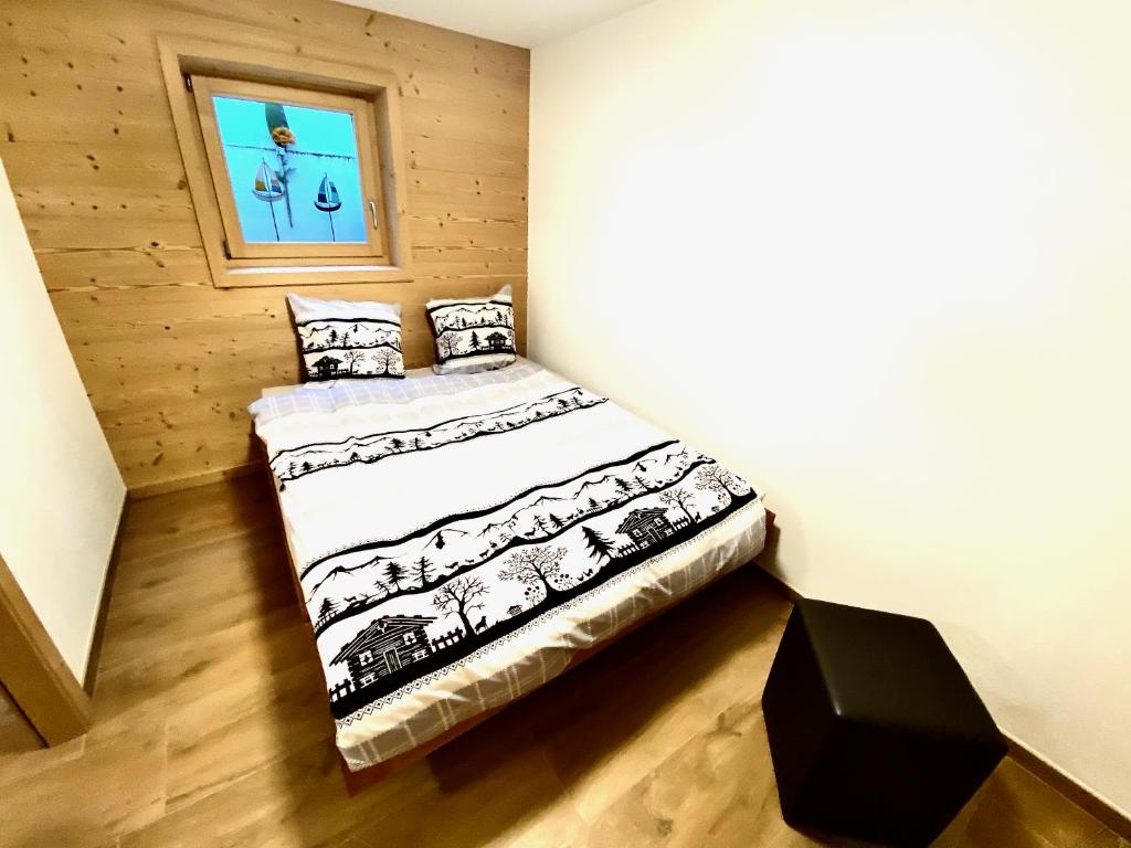 Postel nebo postele na pokoji v ubytování Chalet Neuf, Morgins