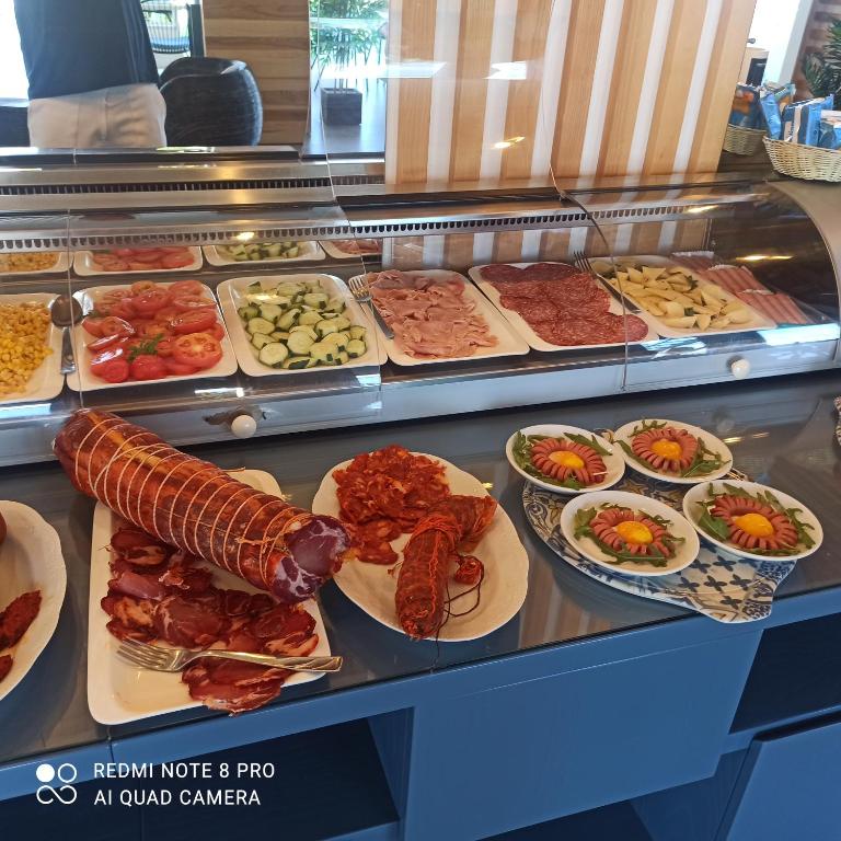a buffet line with many different types of food at Residence Porto Ulisse in Parghelia