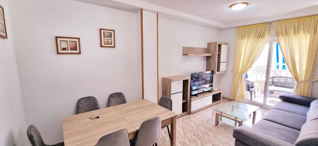 TV a/nebo společenská místnost v ubytování Grand appartement à 5min de la plage