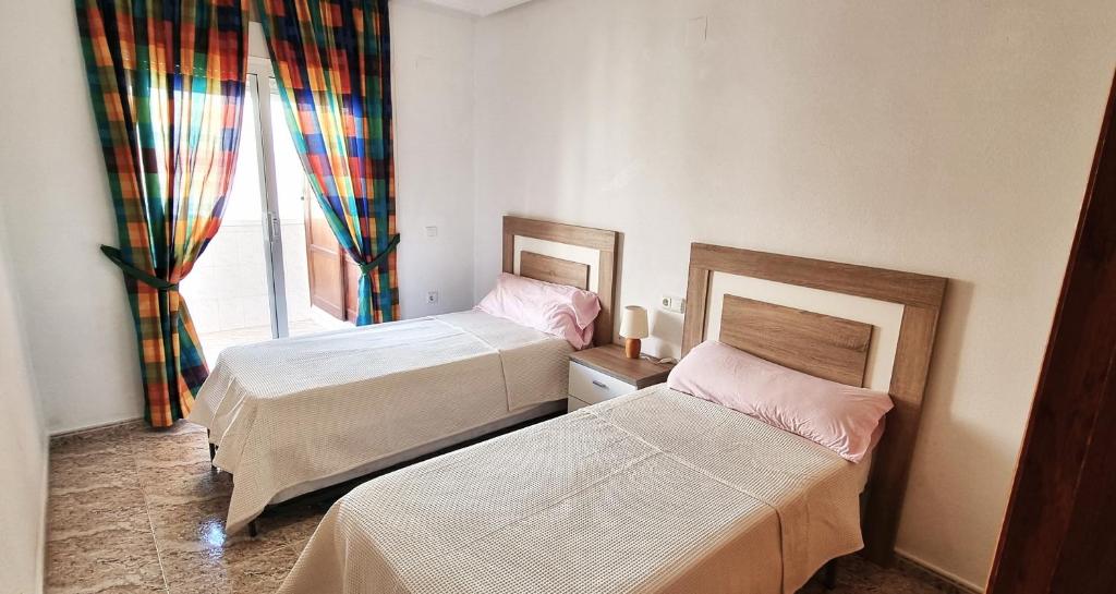 Postel nebo postele na pokoji v ubytování Grand appartement à 5min de la plage