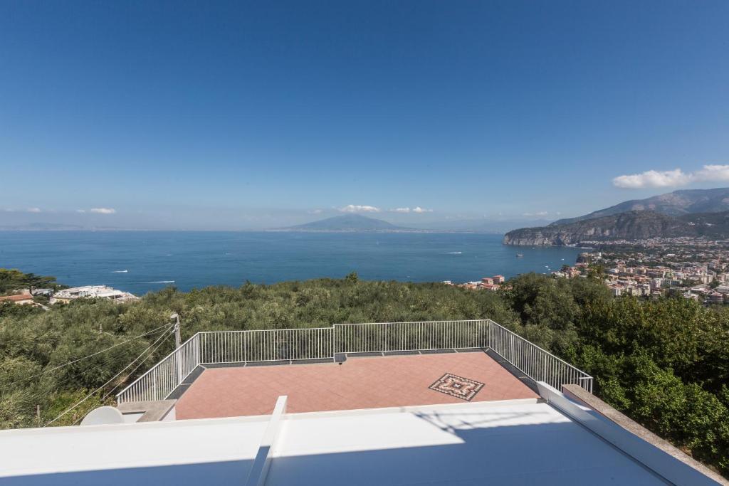 a view of the ocean from the roof of a house at La Terrazza sul Golfo in Sorrento