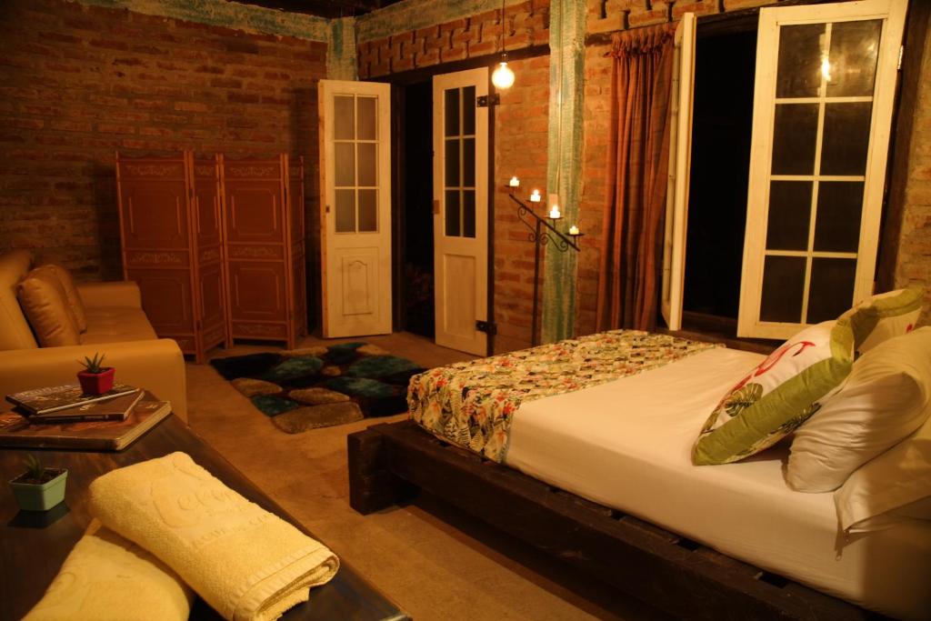 Säng eller sängar i ett rum på Siete Hierbas Hostal