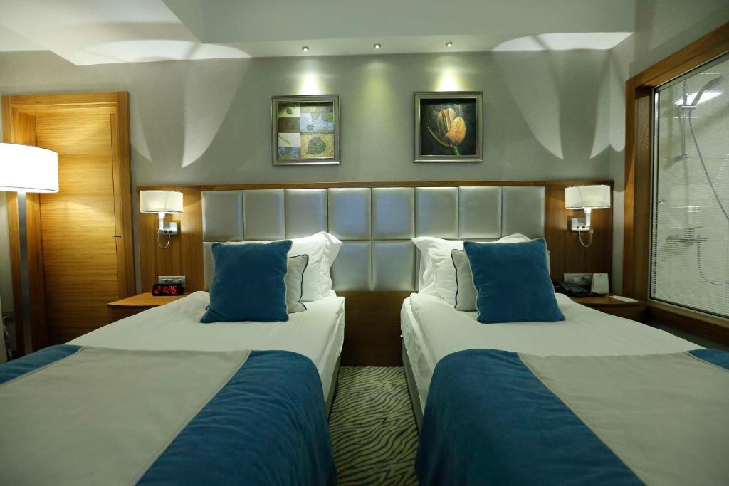 Postel nebo postele na pokoji v ubytování Best Western Premier Karsiyaka Convention & Spa Hotel
