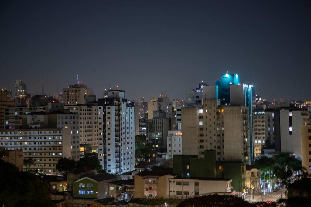 a city skyline at night with blue lights on buildings at Blue Liberdade in São Paulo
