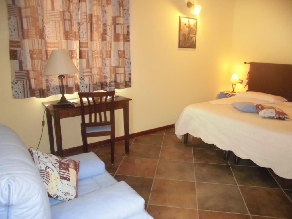 Postel nebo postele na pokoji v ubytování Agriturismo Bio-Ecologico Sant'Isidoro