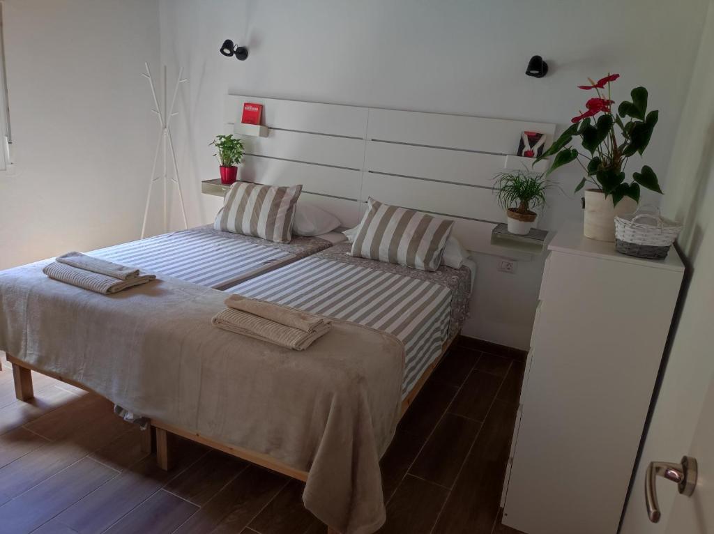 Postel nebo postele na pokoji v ubytování CASA DONELA