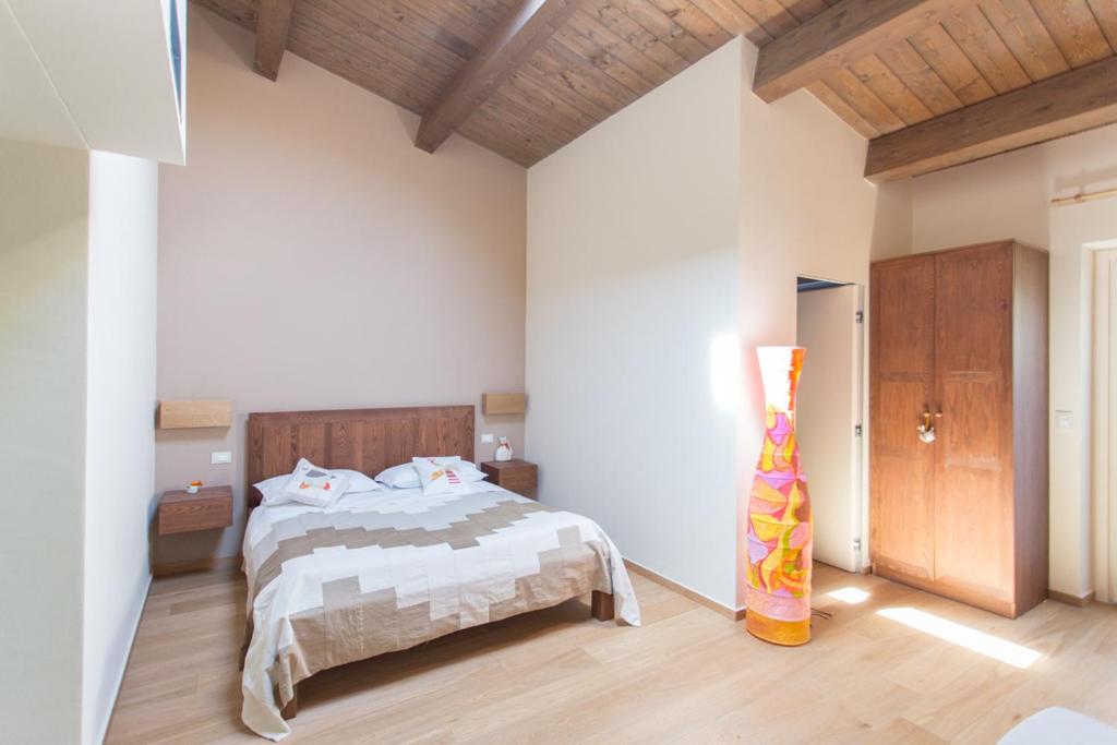 Postel nebo postele na pokoji v ubytování Agriturismo Castelli In Aria