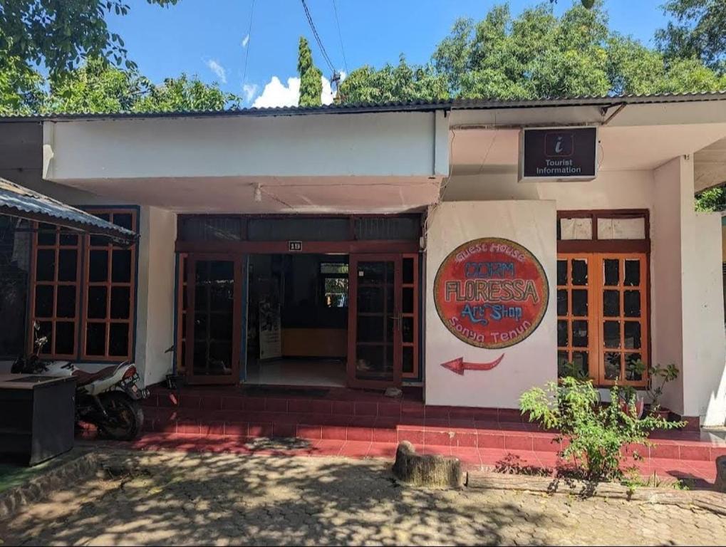 a building with a sign that reads guest house at Guest House Dorm Floressa in Maumere