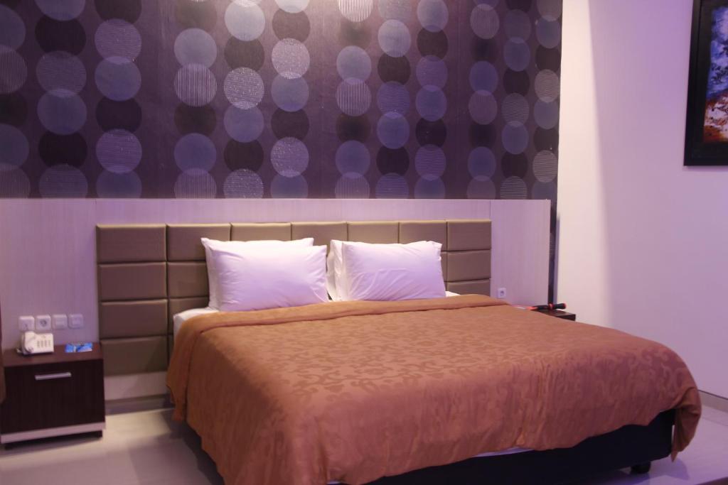 Postel nebo postele na pokoji v ubytování Tlogomas Guest House