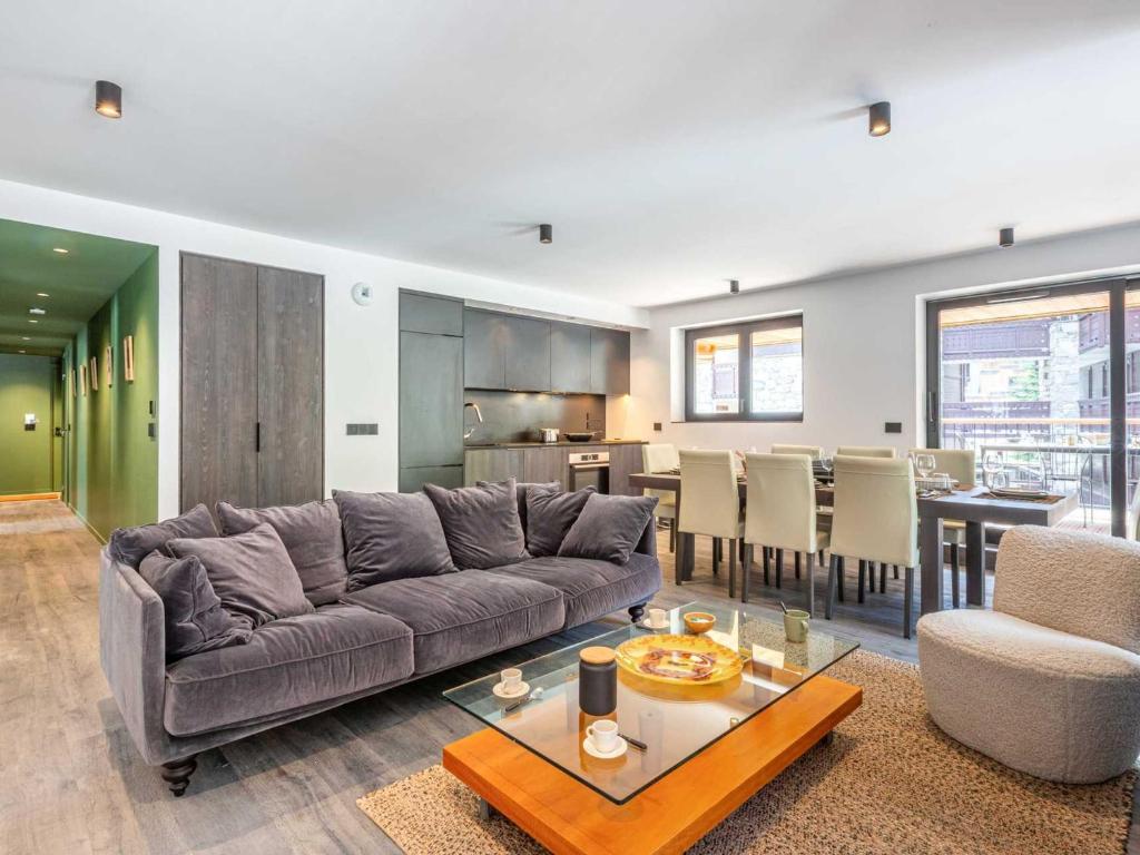 a living room with a couch and a table at Appartement Val-d'Isère, 5 pièces, 8 personnes - FR-1-694-325 in Val-d'Isère