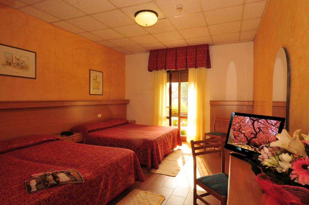 Postel nebo postele na pokoji v ubytování Hotel Al Mare