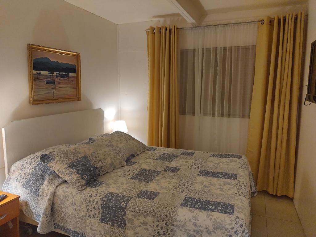 מיטה או מיטות בחדר ב-Hostal Renca, Casa Hotel