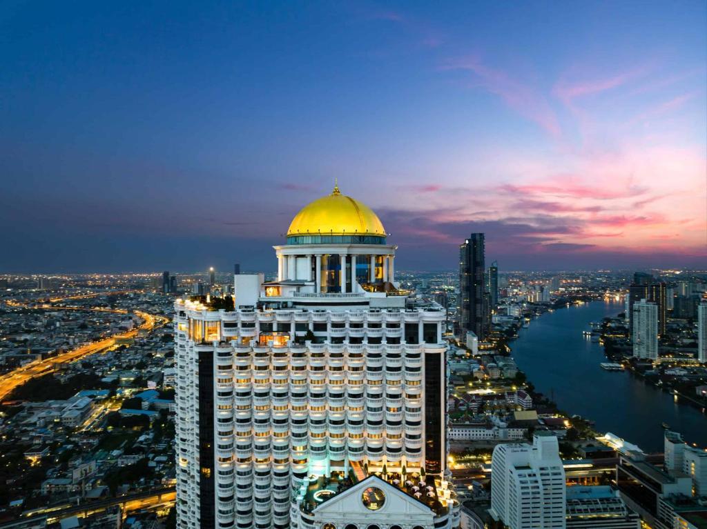 a building with a gold dome on top of it at Tower Club at lebua in Bangkok