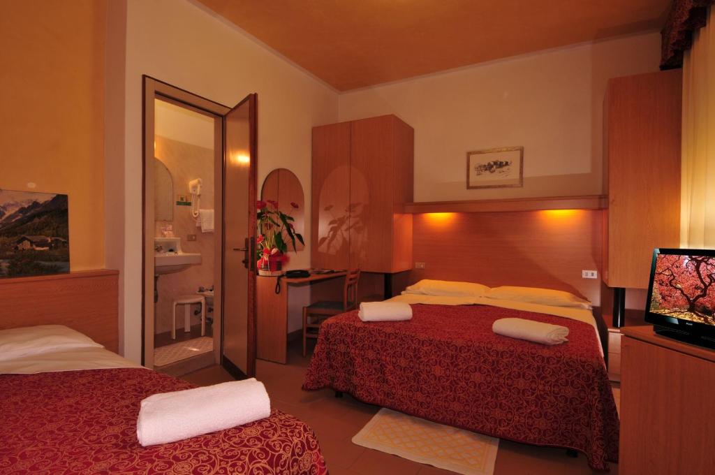 Postel nebo postele na pokoji v ubytování Hotel Al Mare