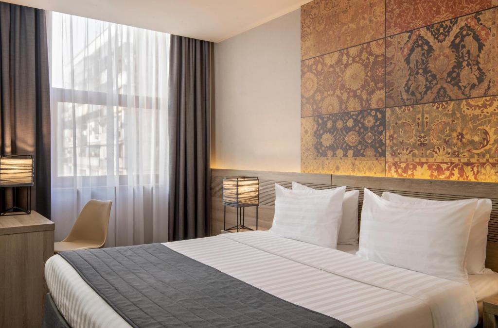 Postel nebo postele na pokoji v ubytování Republica Hotel Yerevan