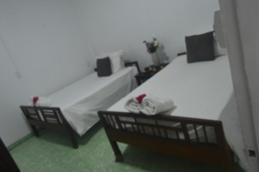Postel nebo postele na pokoji v ubytování Hoi An Viet House Homestay
